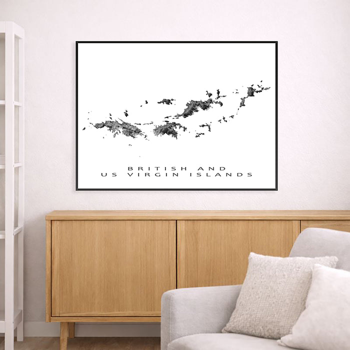 Framed map of British and US Virgin Islands above a wooden cabinet and sofa.