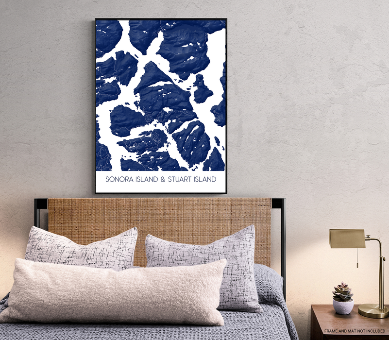 Bedroom with a map of Sonora Island & Stuart Island on the wall