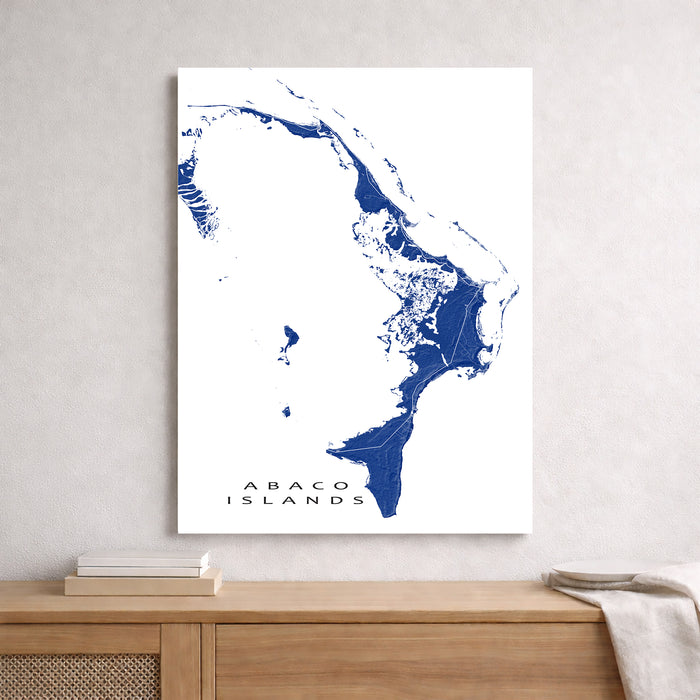 Map of Abaco Islands on a white wall above a wooden surface