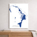 Map of Abaco Islands on a white wall above a wooden surface