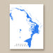 Map of Abaco Islands in blue on a white background, framed against a beige wall.