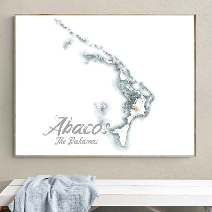 Framed map of Abaco, The Bahamas on a wall above a bench.