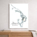 Map of Abaco, The Bahamas on a white wall above a wooden shelf.