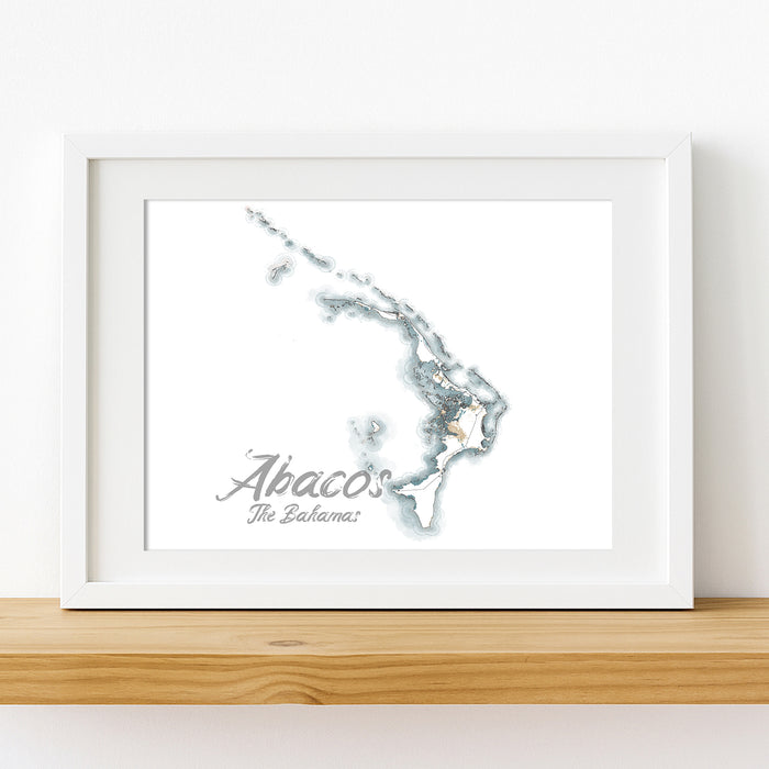 Framed map of Abaco, The Bahamas on a white wall.