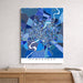 Map of Ahmedabad in blue tones on a white wall above a wooden surface.