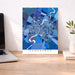 Colorful map of Ahmedabad on a desk with a laptop and plant