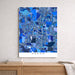 Map of Akron in blue tones on a white wall above a wooden surface.