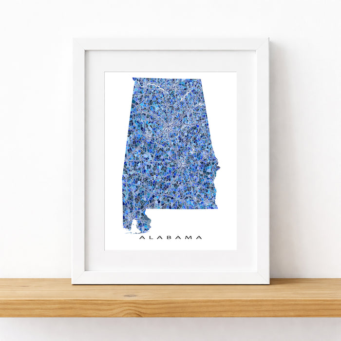 Framed map of Alabama with a blue watercolor design on a white background