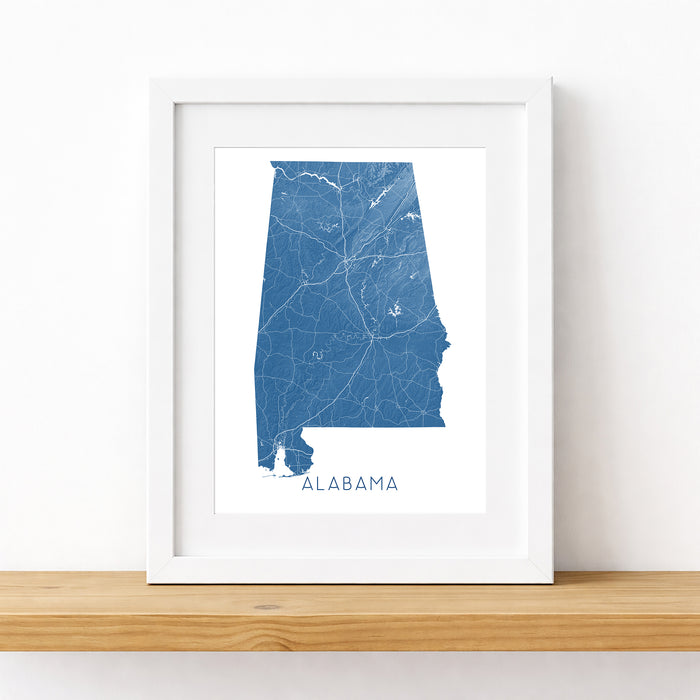 Framed map of Alabama on a white wall