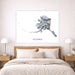 Map of Alaska on a wall above a bed in a bedroom