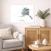 Living room with a gray sofa, wooden cabinet, and Alaska map print on the wall.