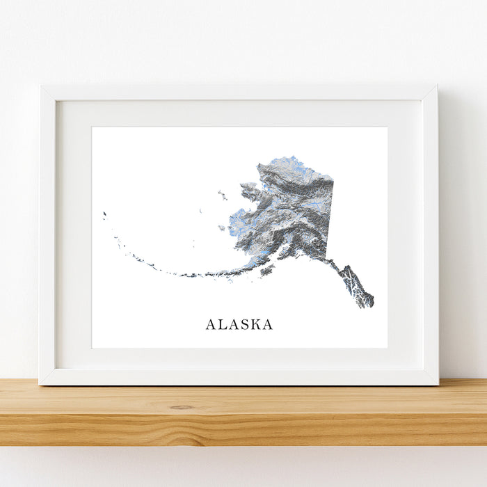 Framed map of Alaska on a white wall