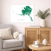 Living room with a gray sofa, wooden cabinet, and a framed map of Alaska on the wall.