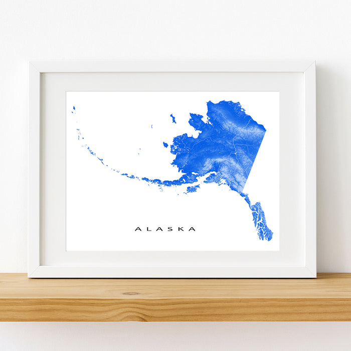 Framed map of Alaska with blue watercolor design on a white background