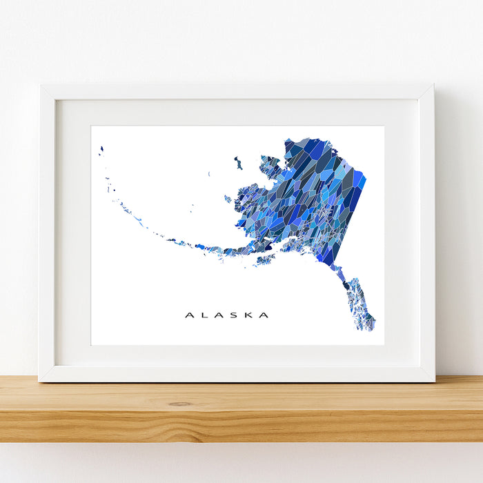 Framed map of Alaska with a blue abstract design on a white background