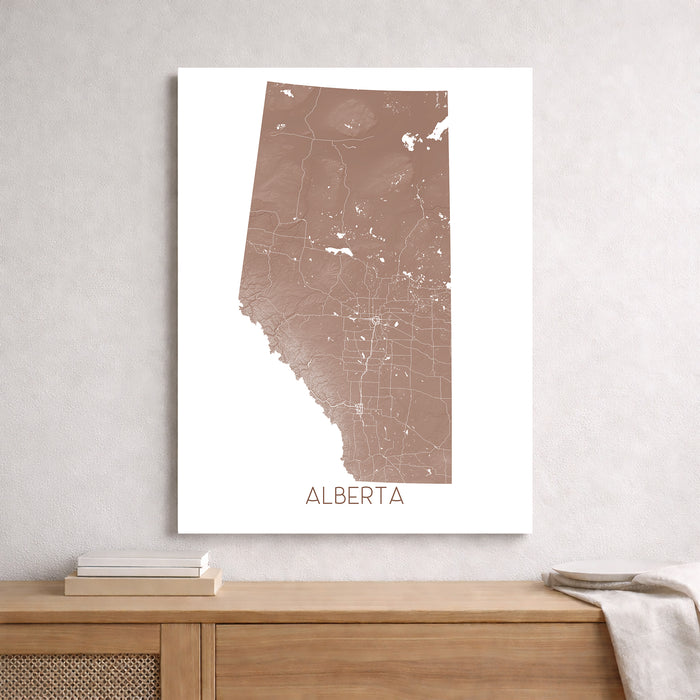 Map of Alberta on a white wall above a wooden shelf.