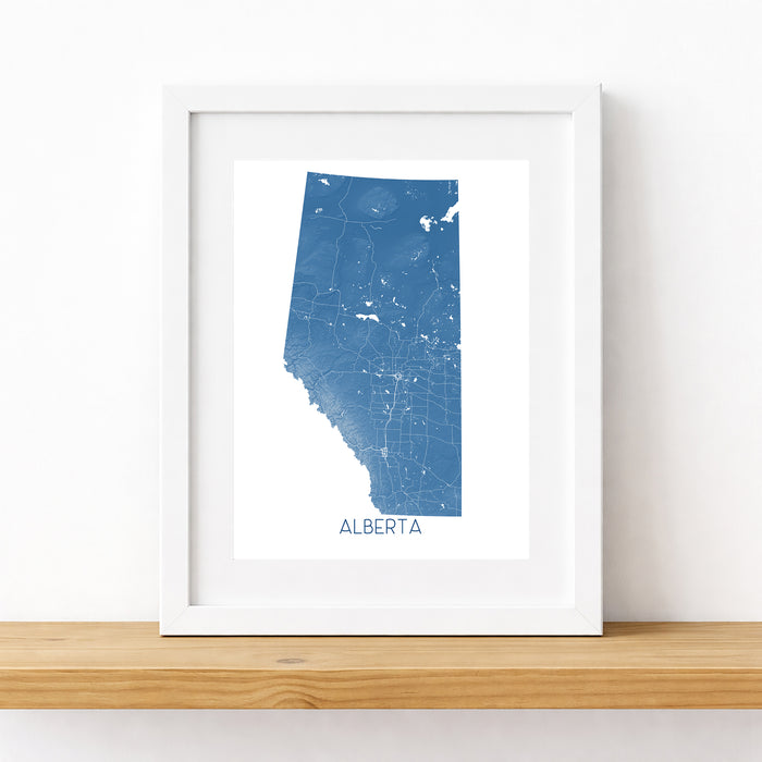 Framed map of Alberta on a white wall