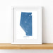 Framed map of Alberta on a white wall