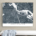 Framed map of Amsterdam on a wall above a white bench.