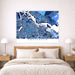 Map of Amsterdam on a wall above a bed in a bedroom