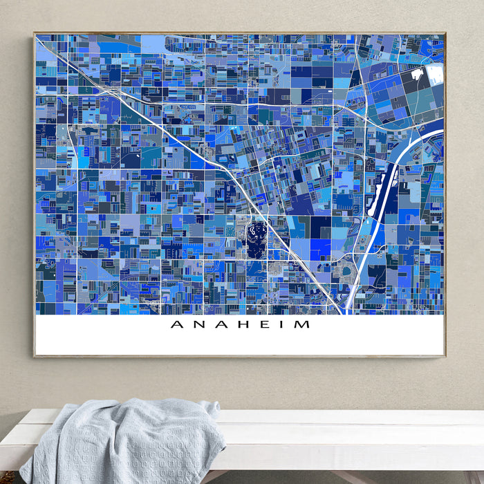 Framed map of Anaheim with a blue mosaic design on a wall.