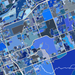 Map with a grid of blue and black squares, likely representing a census tract map.