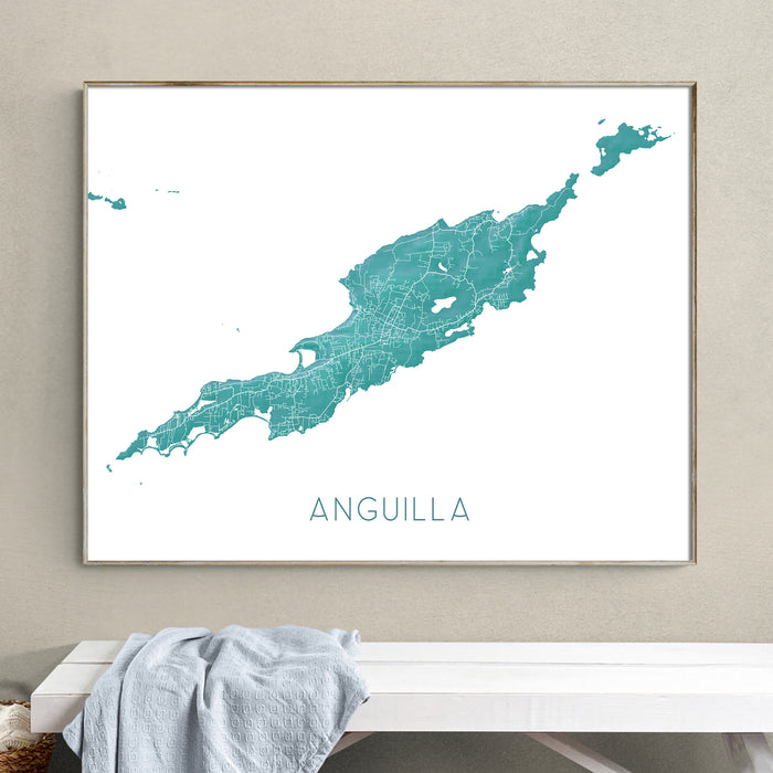 Framed map of Anguilla on a wall above a bench.