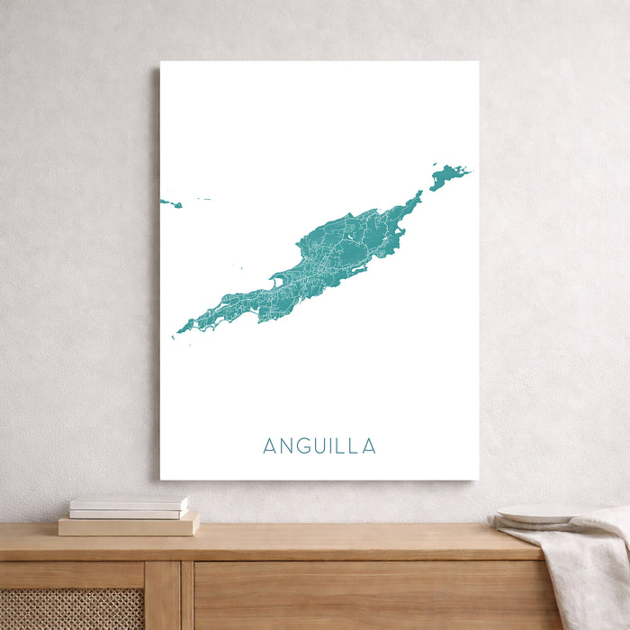 Framed map of Anguilla on a wall above a wooden shelf.