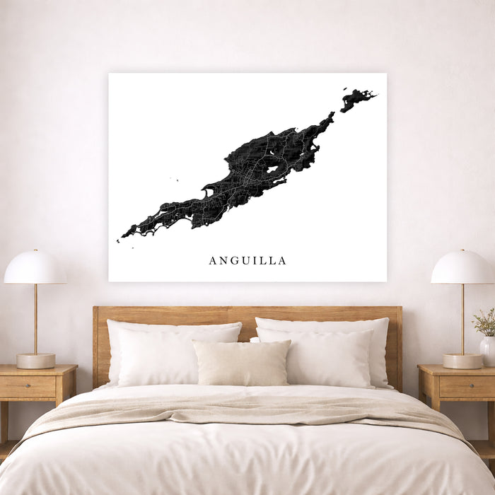 Map of Anguilla on a wall above a bed in a bedroom setting