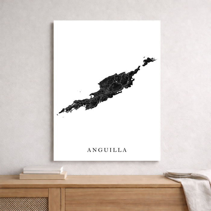 Map of Anguilla on a white wall above a wooden shelf.