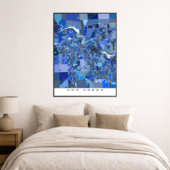 Framed map of Ann Arbor above a bed in a bedroom