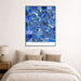 Framed map of Ann Arbor above a bed in a bedroom