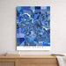 Map of Ann Arbor in blue tones on a white wall above a wooden surface.