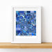 Framed map of Ann Arbor with a blue color scheme on a white surface.