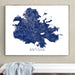 Framed map of Antigua on a wall above a white surface.