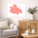 Living room with a gray sofa, wooden cabinet, and decorative items including a map of Antigua.