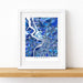 Framed map of Antwerp with a blue mosaic design on a white background