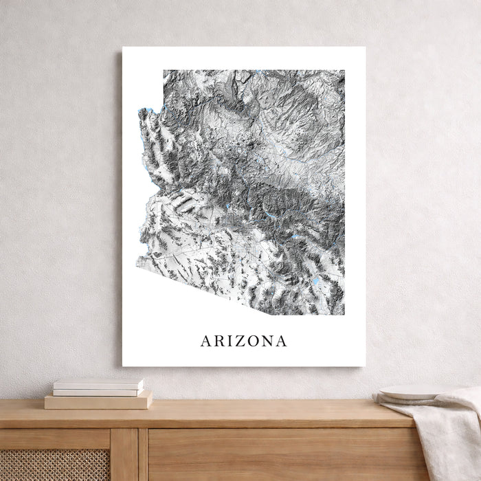 Map of Arizona on a white background above a wooden surface