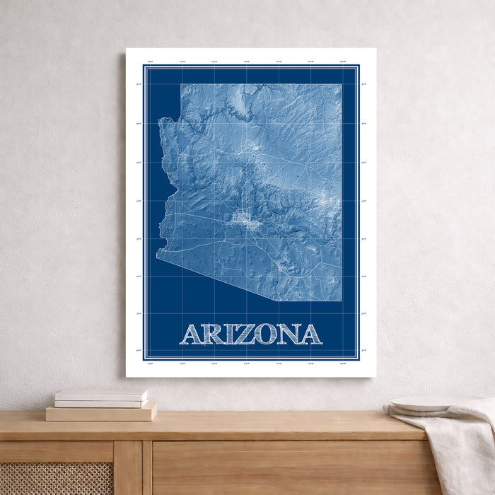 Framed map of Arizona on a wall above a wooden surface