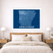 Framed map of Arkansas above a bed in a bedroom setting