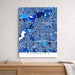Map of Arlington in blue tones on a white wall above a wooden surface.