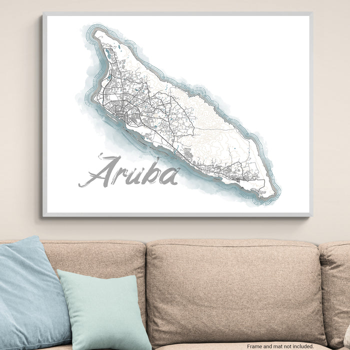 Framed map of Aruba on a wall above a sofa
