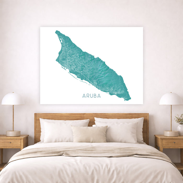 Map of Aruba on a wall above a bed in a bedroom setting