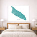 Map of Aruba on a wall above a bed in a bedroom setting