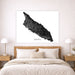 Map of Aruba on a wall above a bed in a bedroom setting