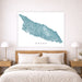 Map of Aruba on a wall above a bed in a bedroom