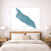 Map of Aruba on a wall above a bed in a bedroom setting