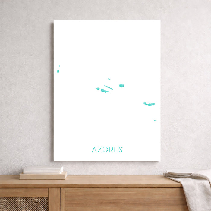 Map of the Azores on a white wall above a wooden shelf.