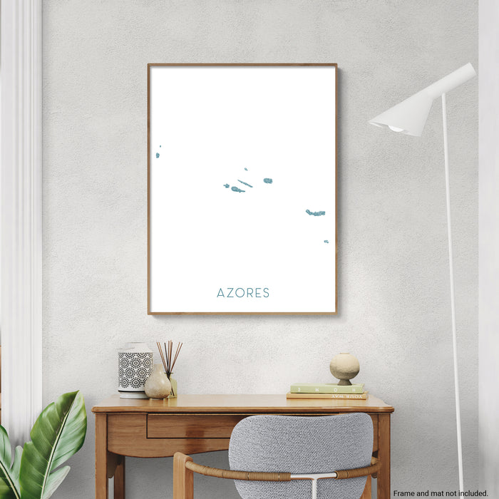 Framed artwork with 'Azores' text on a wall above a desk.
