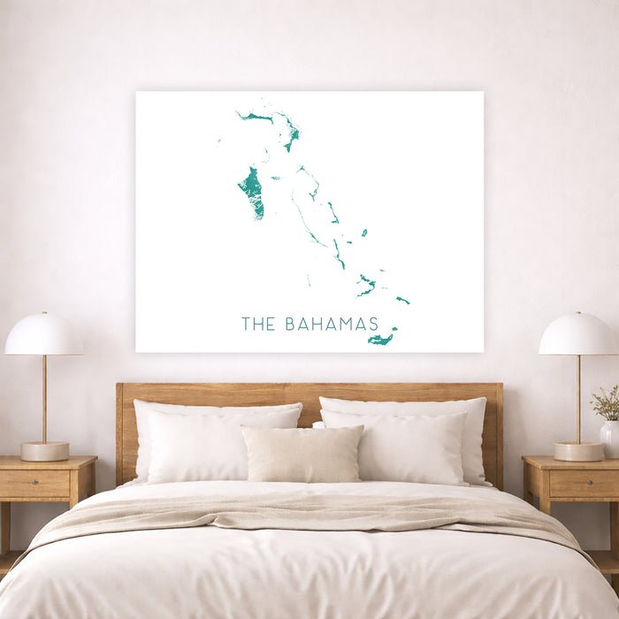 Map of The Bahamas on a wall above a bed in a bedroom.